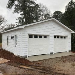 white detached garage with side door